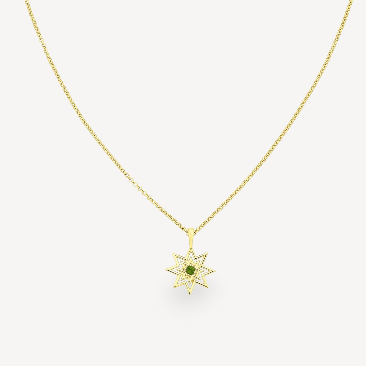 EC One NORA necklace featuring a gold plated star pendant with a central green chrome diopside gemstone