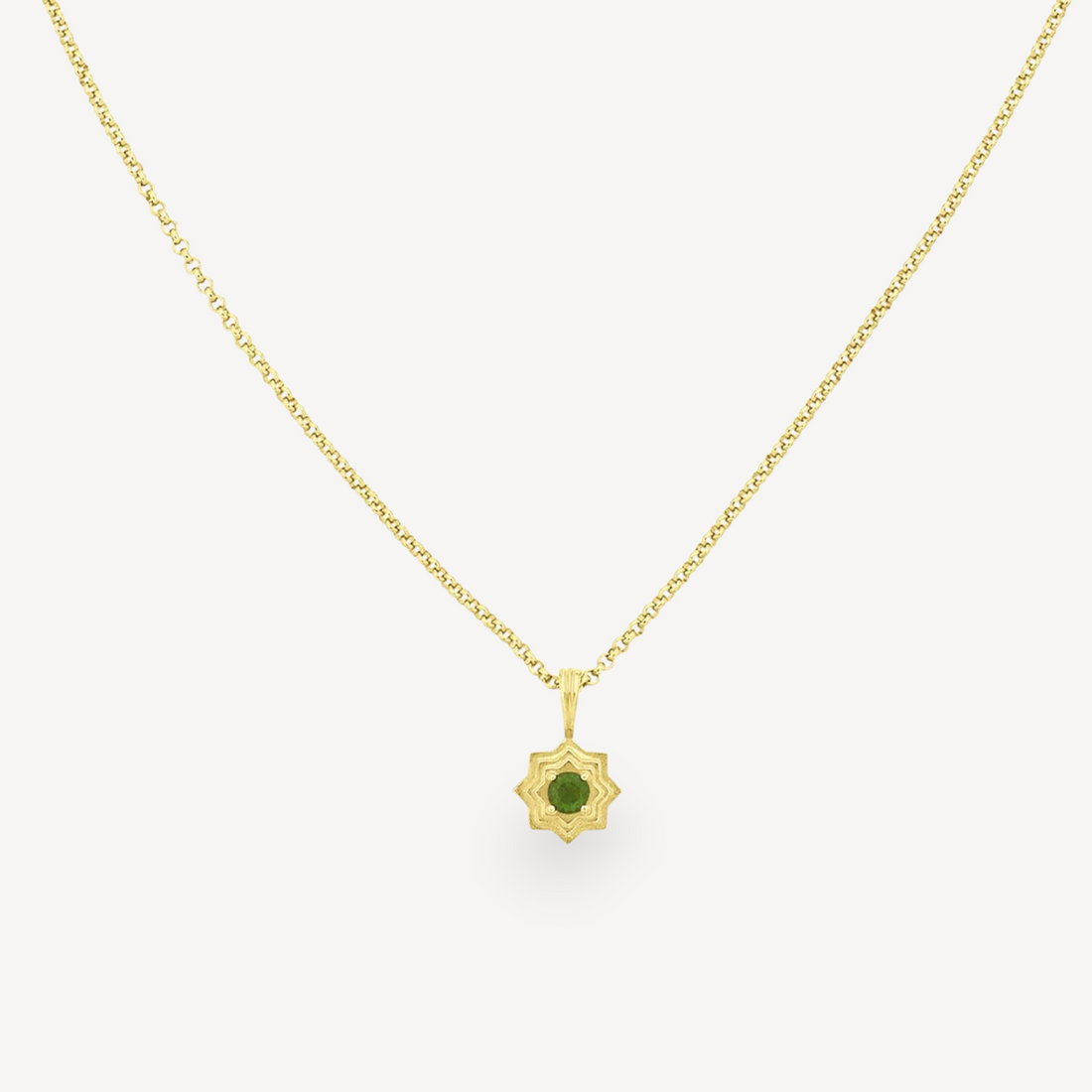 EC One SITARA necklace featuring a round green chrome diopside stone set in a gold plated star-shaped pendant