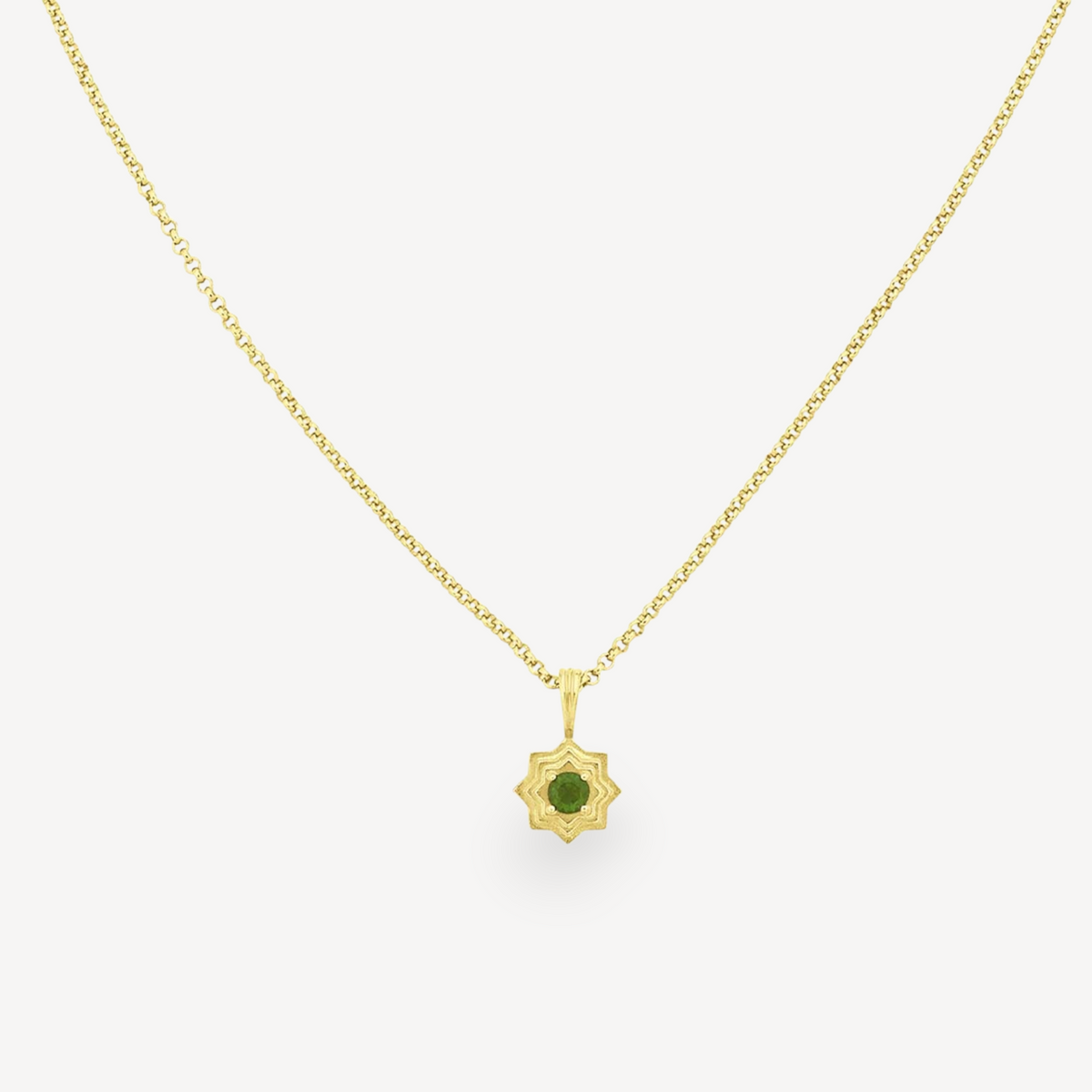 EC One SITARA necklace featuring a round green chrome diopside stone set in a gold plated star-shaped pendant