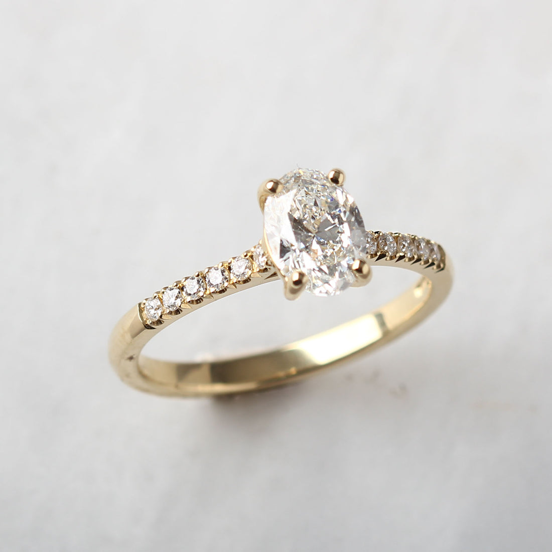 NANCY Oval Diamond Solitaire Ring with Diamond Shoulders