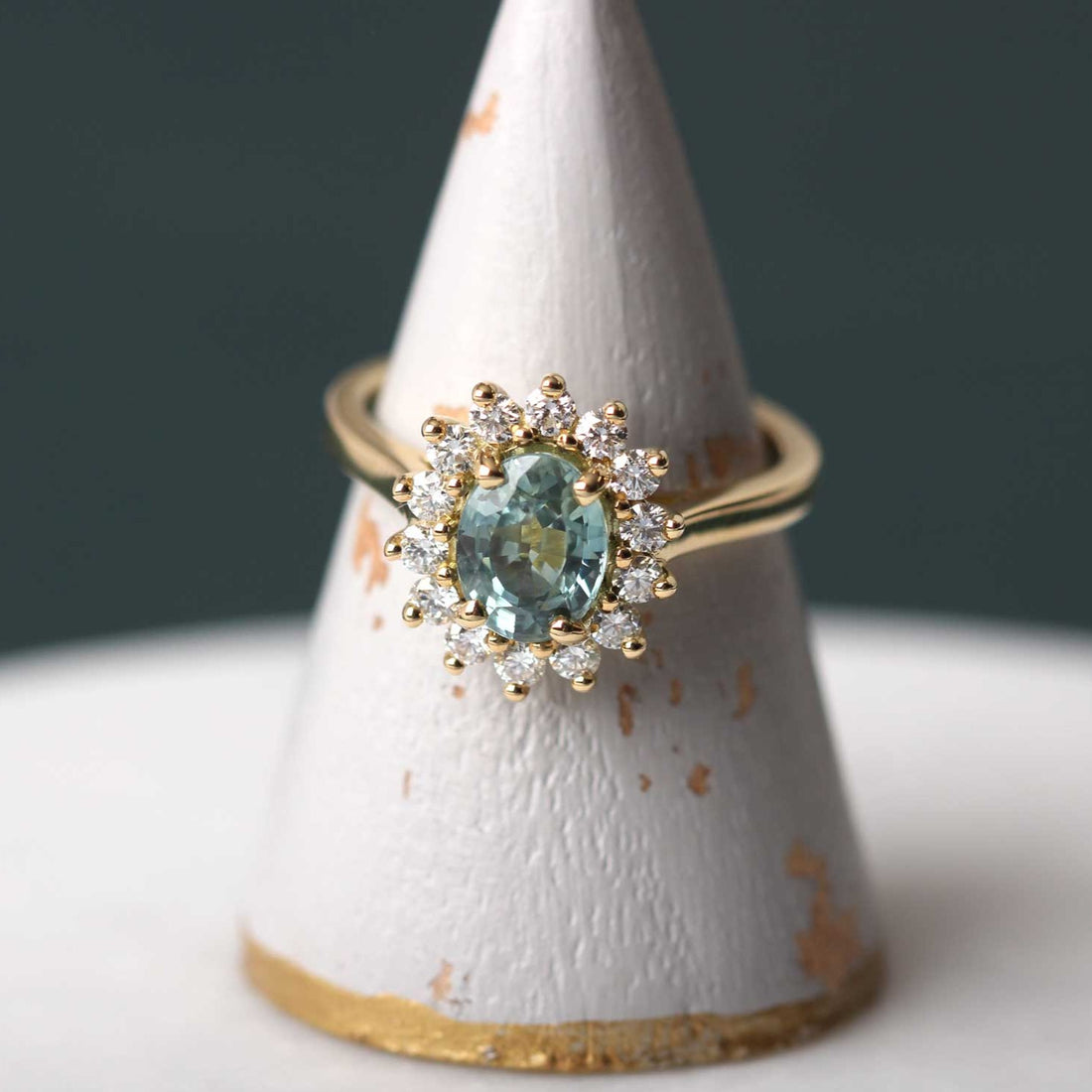 EC One Florence Engagement ring with pale teal sapphire and white diamonds in recycled yellow gold made in our B Corp London workshop